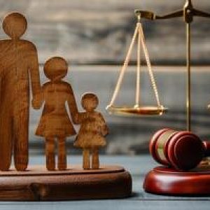 ai-generated-family-law-figure-of-parents-with-children-scales-and-gavel-on-wooden-table-photo (1) ART law